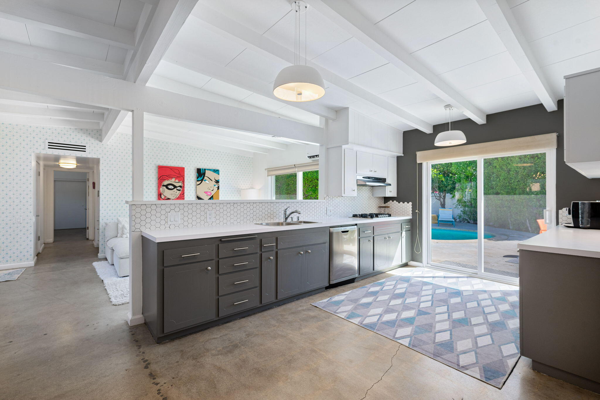 a kitchen with stainless steel appliances granite countertop a sink and cabinets