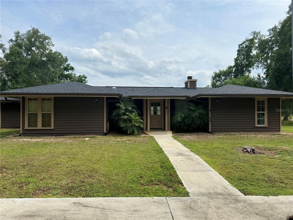 front view of a house with a yard