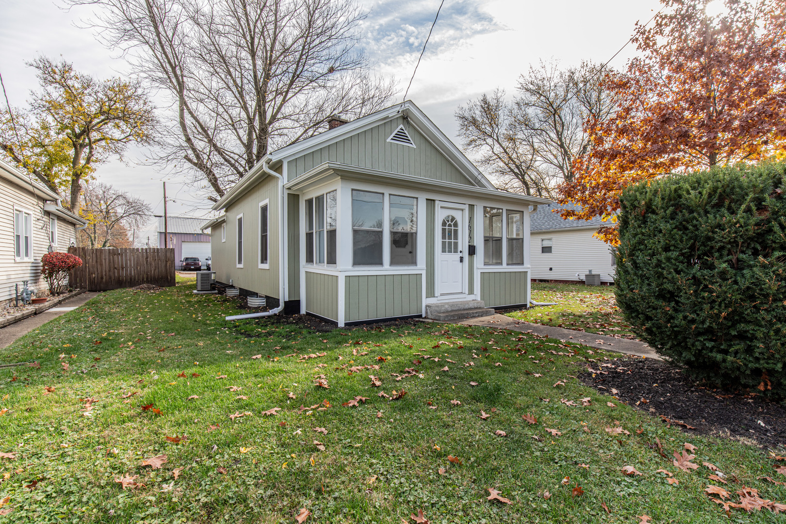 a view of a house with a yard