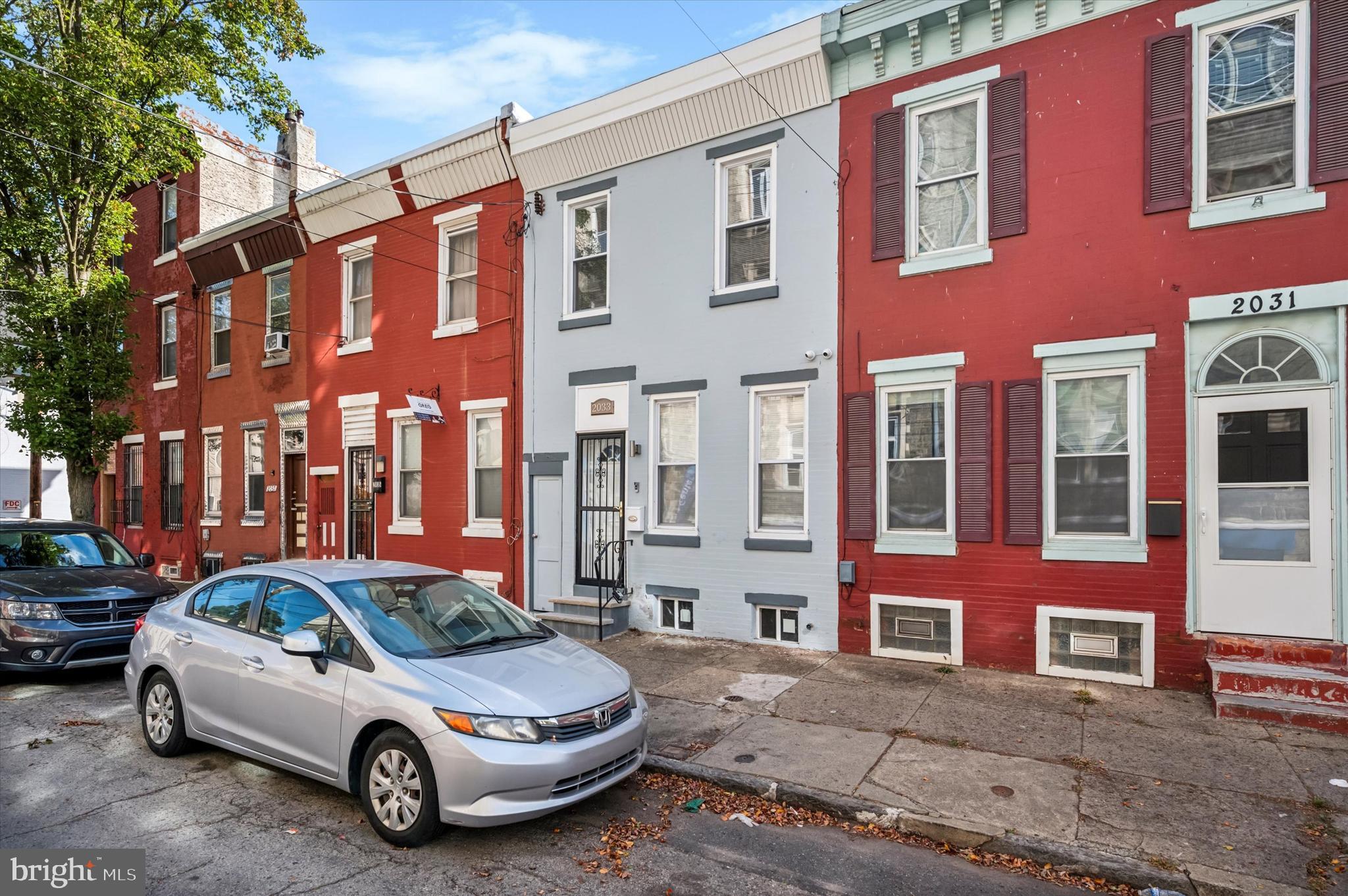 a car parked in front of a brick building