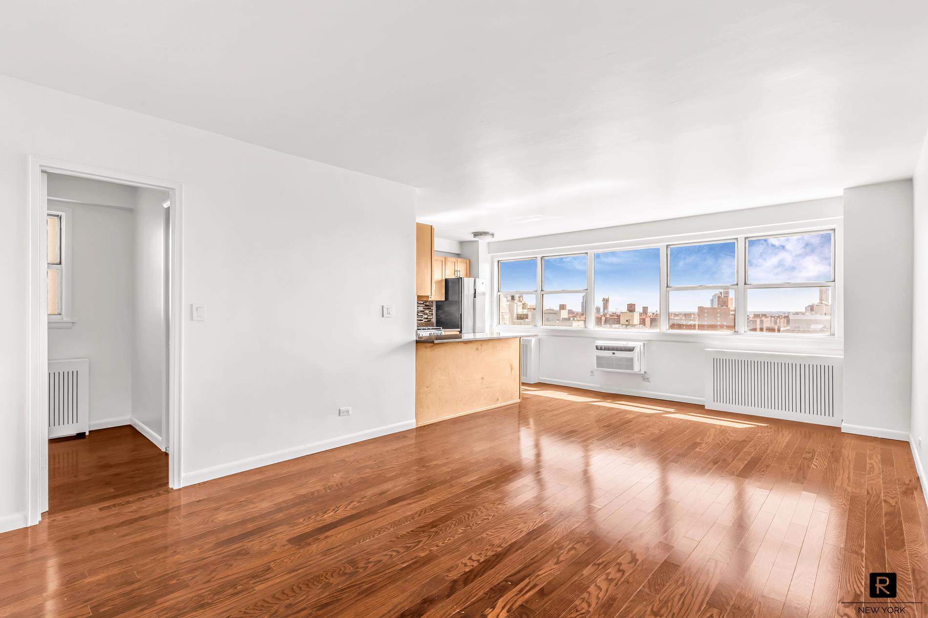 a view of kitchen with wooden floor