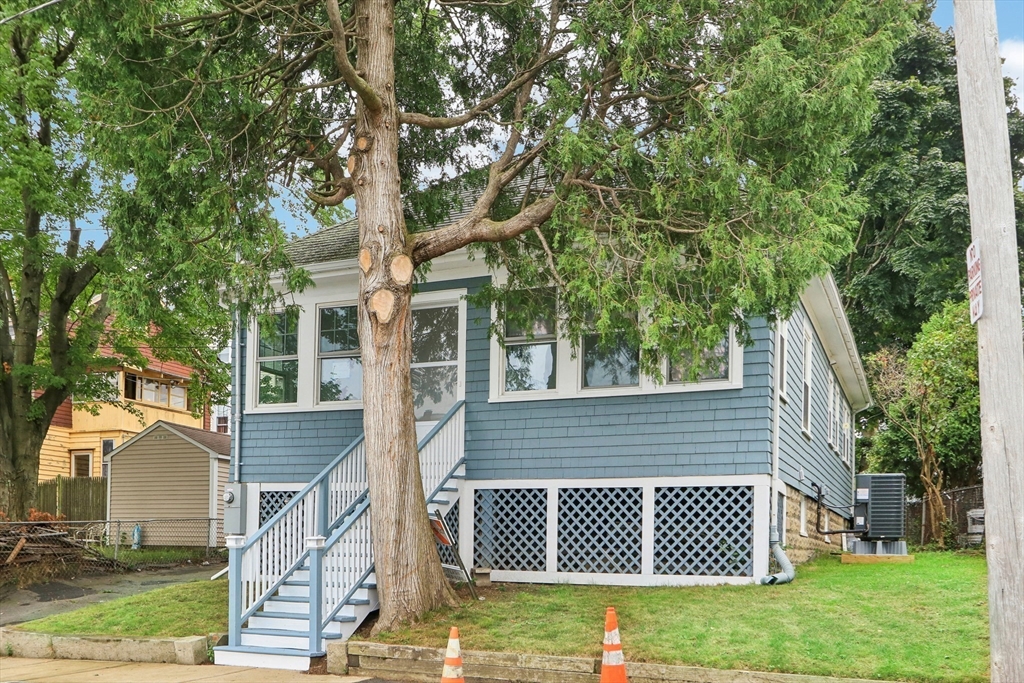 front view of a house with a yard