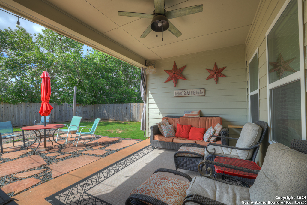 a patio with table and chairs