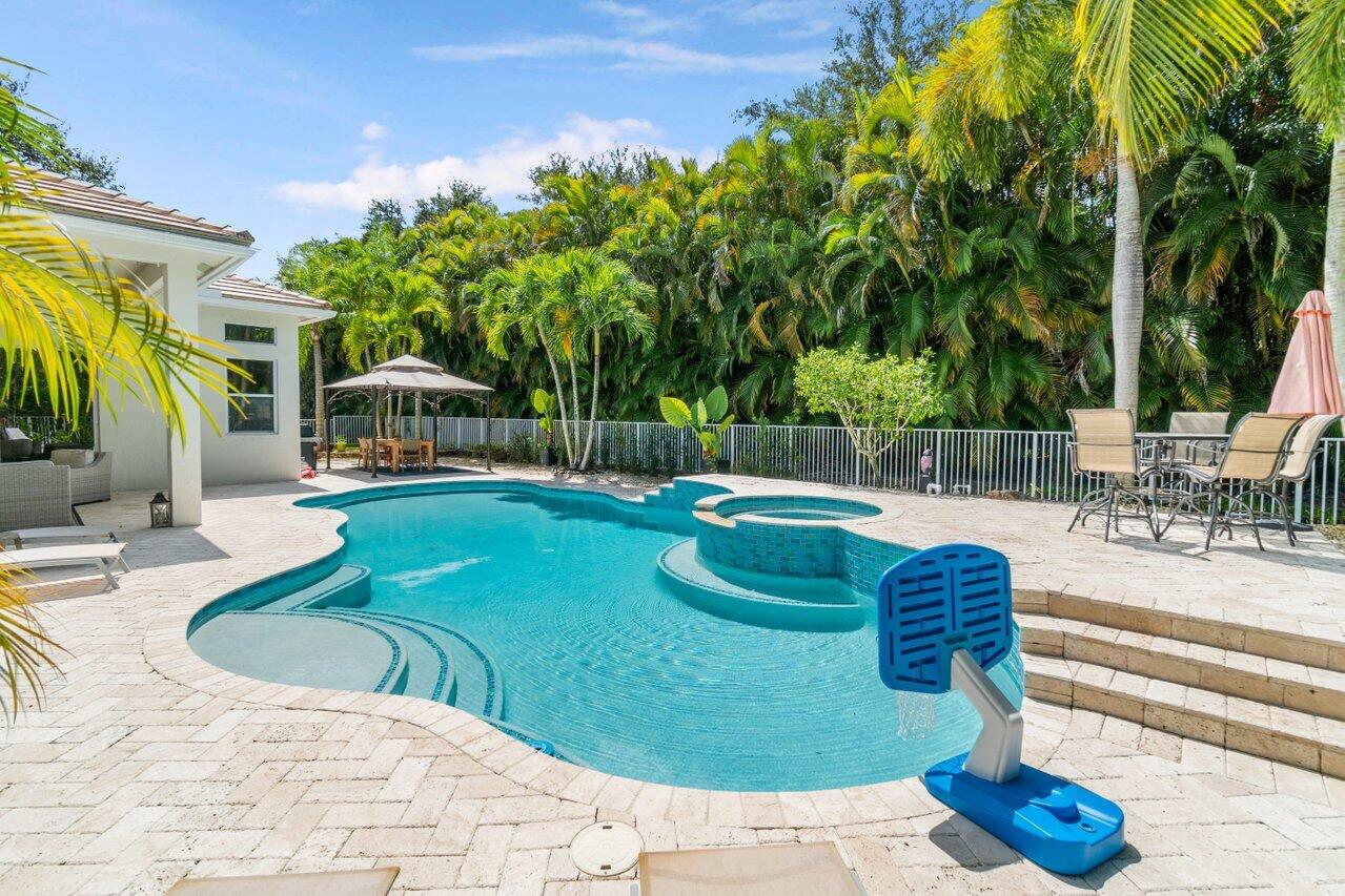 a view of a swimming pool with a patio