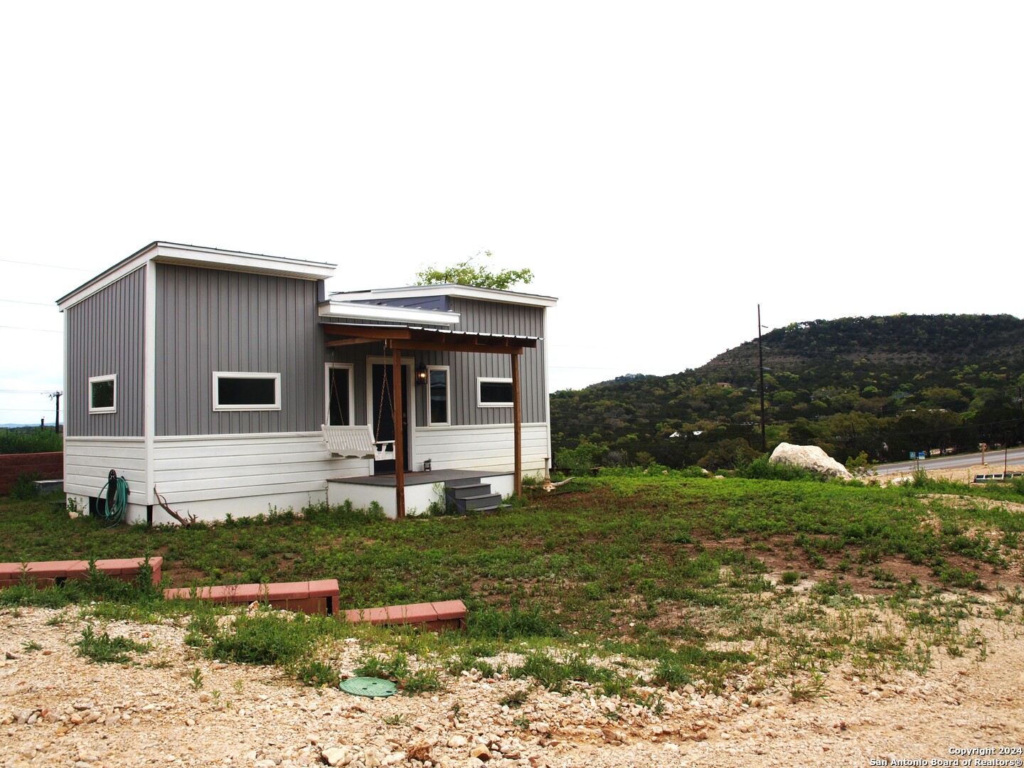 a front view of a house with garden