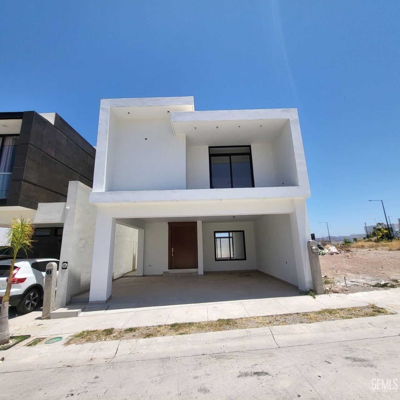 front view of a house with a road