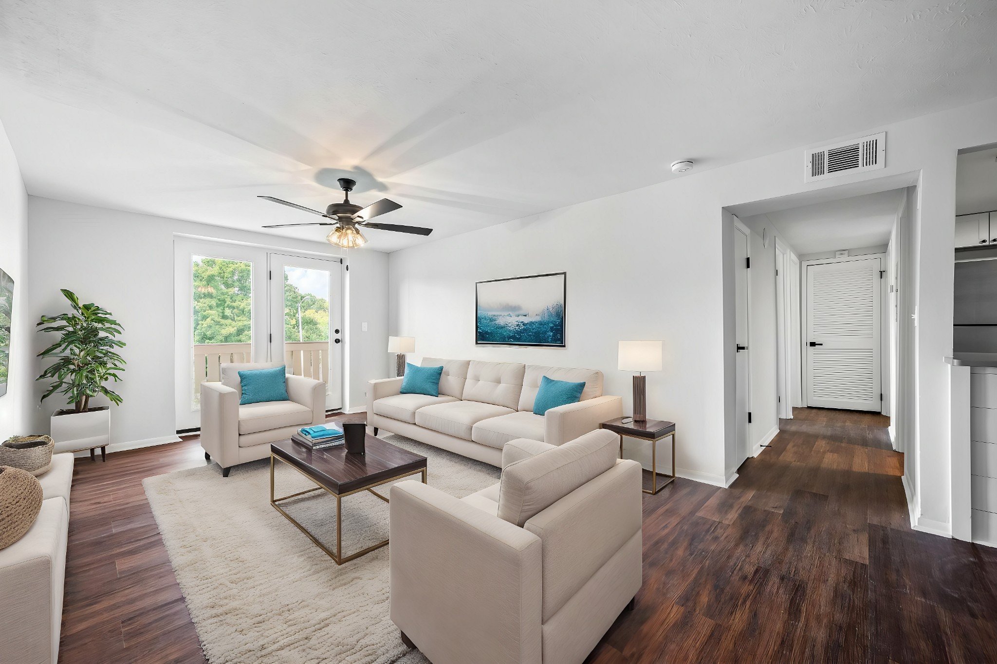 a living room with furniture and a large window