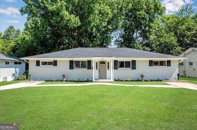 a house that has a big yard in front of it