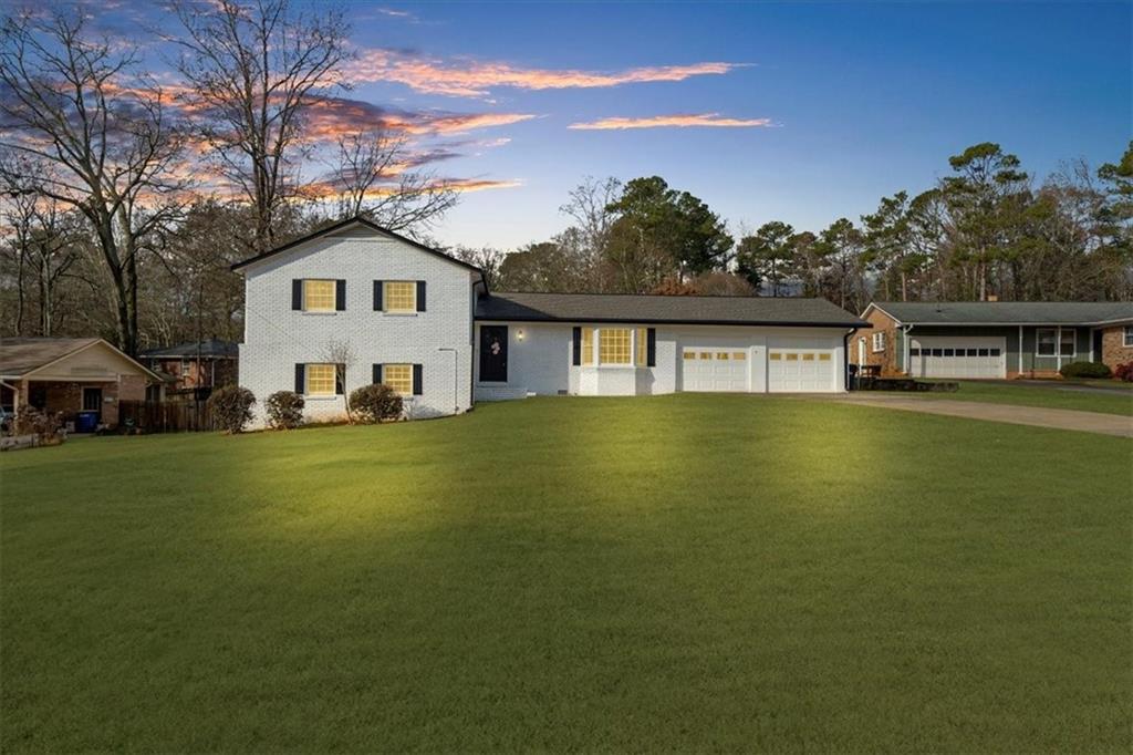 a view of a house with a big yard