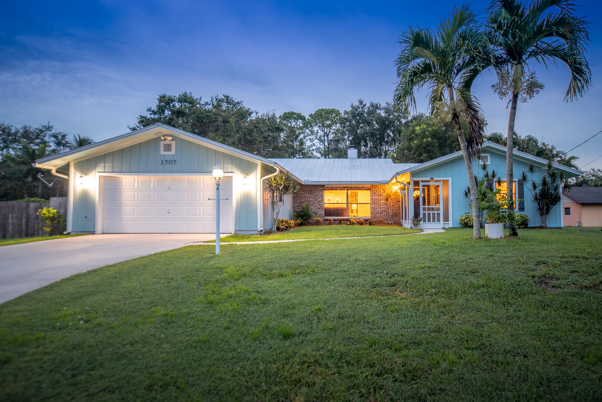 a front view of house with yard and outdoor seating