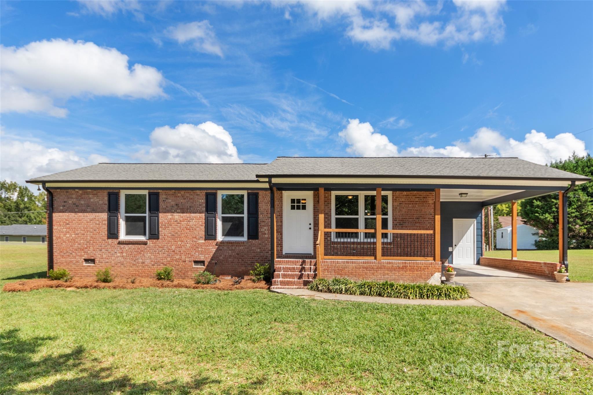 front view of a house with a yard