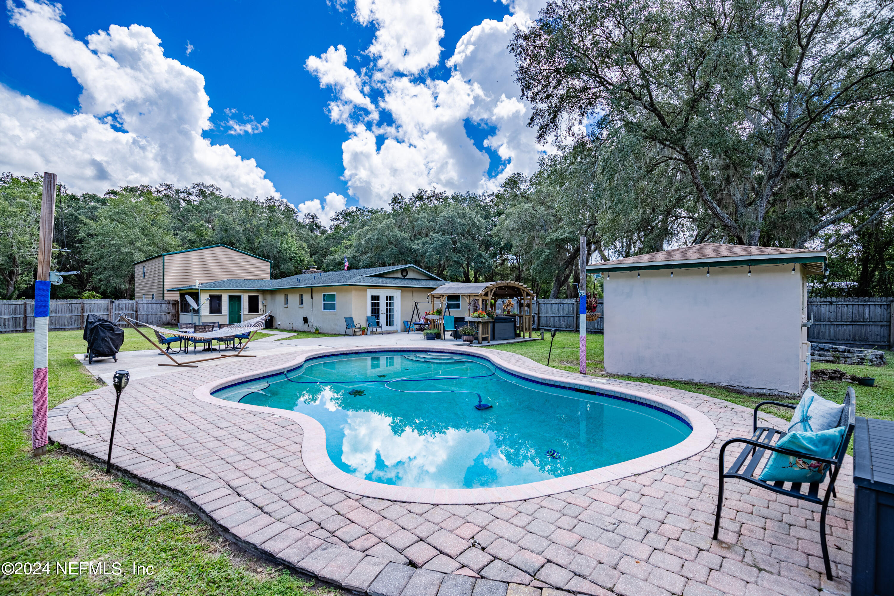 a view of a swimming pool with a patio