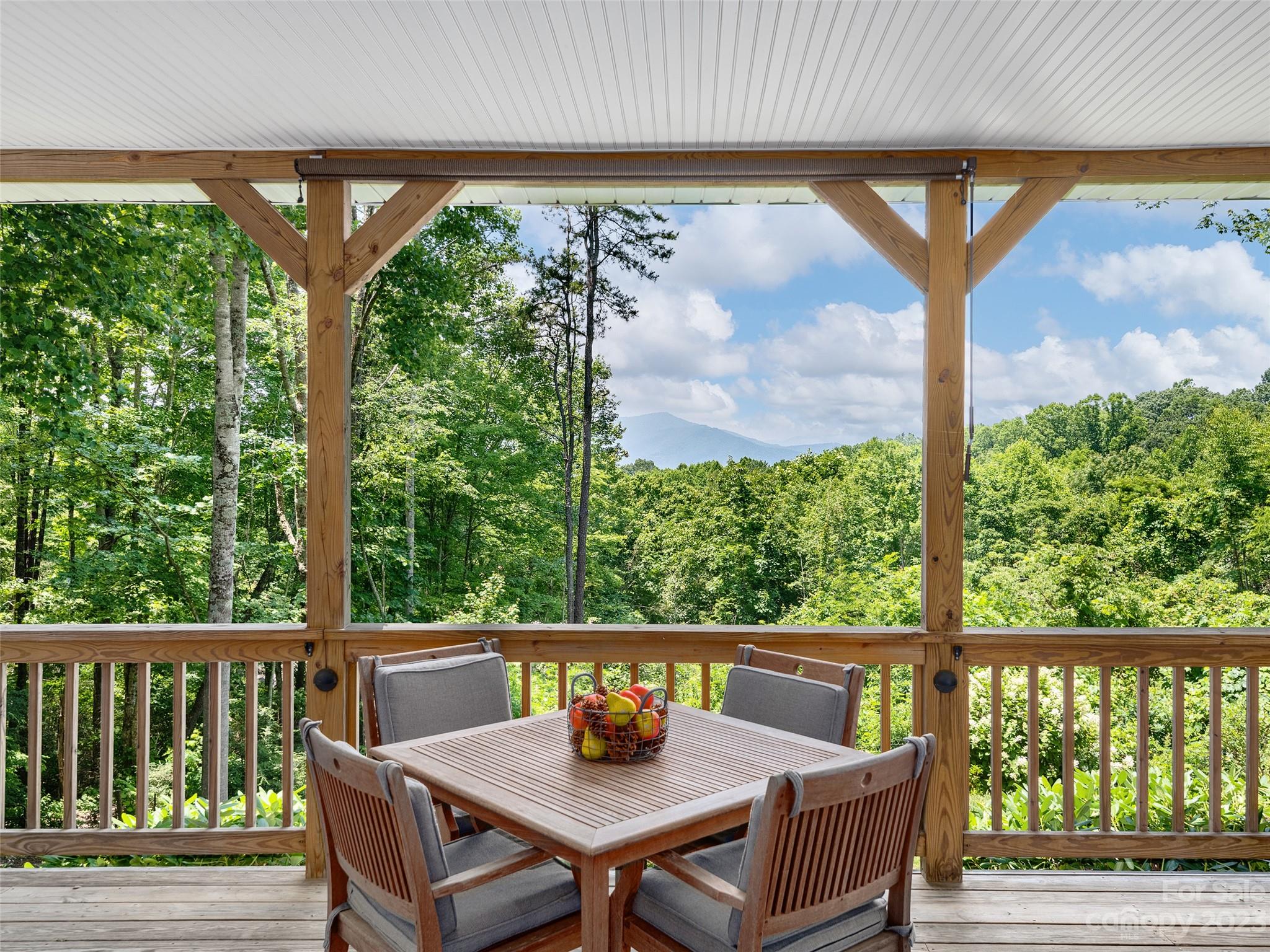 a view of a chairs and table in the balcony