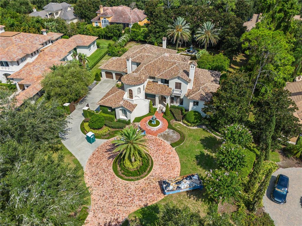 an aerial view of a house with outdoor space