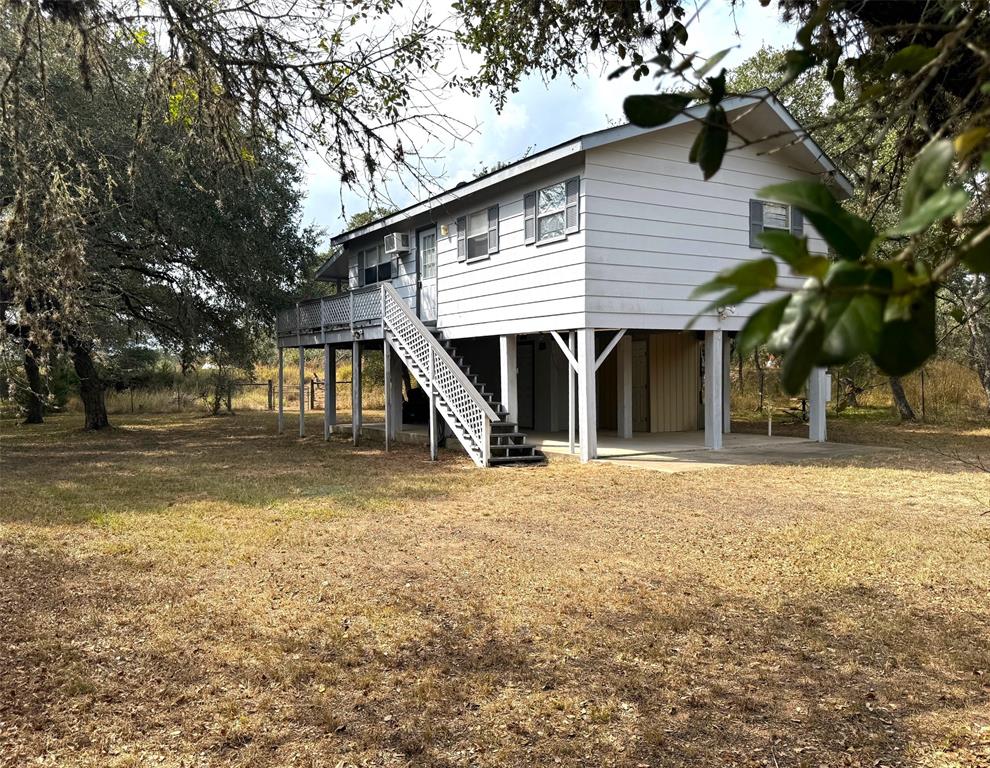 a view of a house with a yard and garage