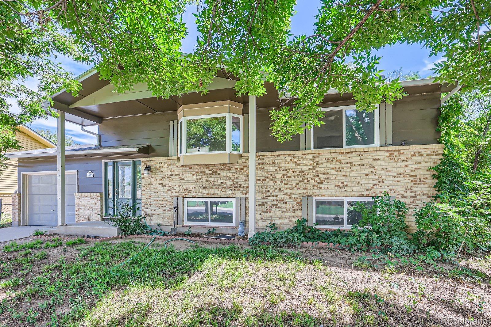 front view of a house with a garden