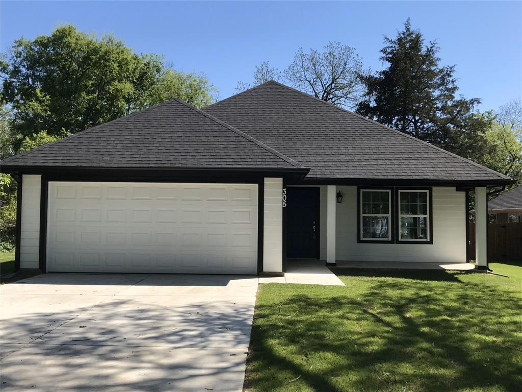 a house with yard in front of it