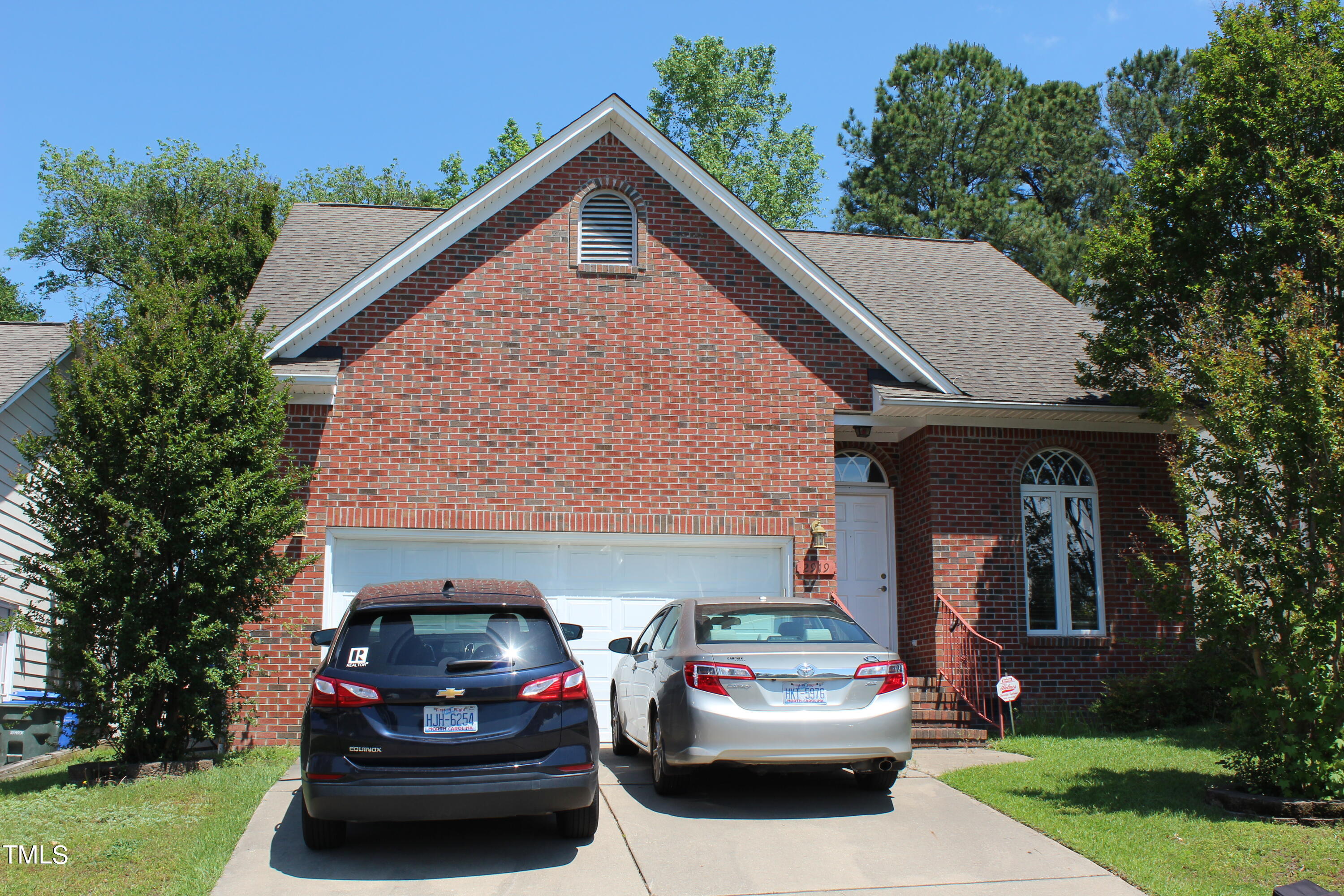 a car parked in front of a house