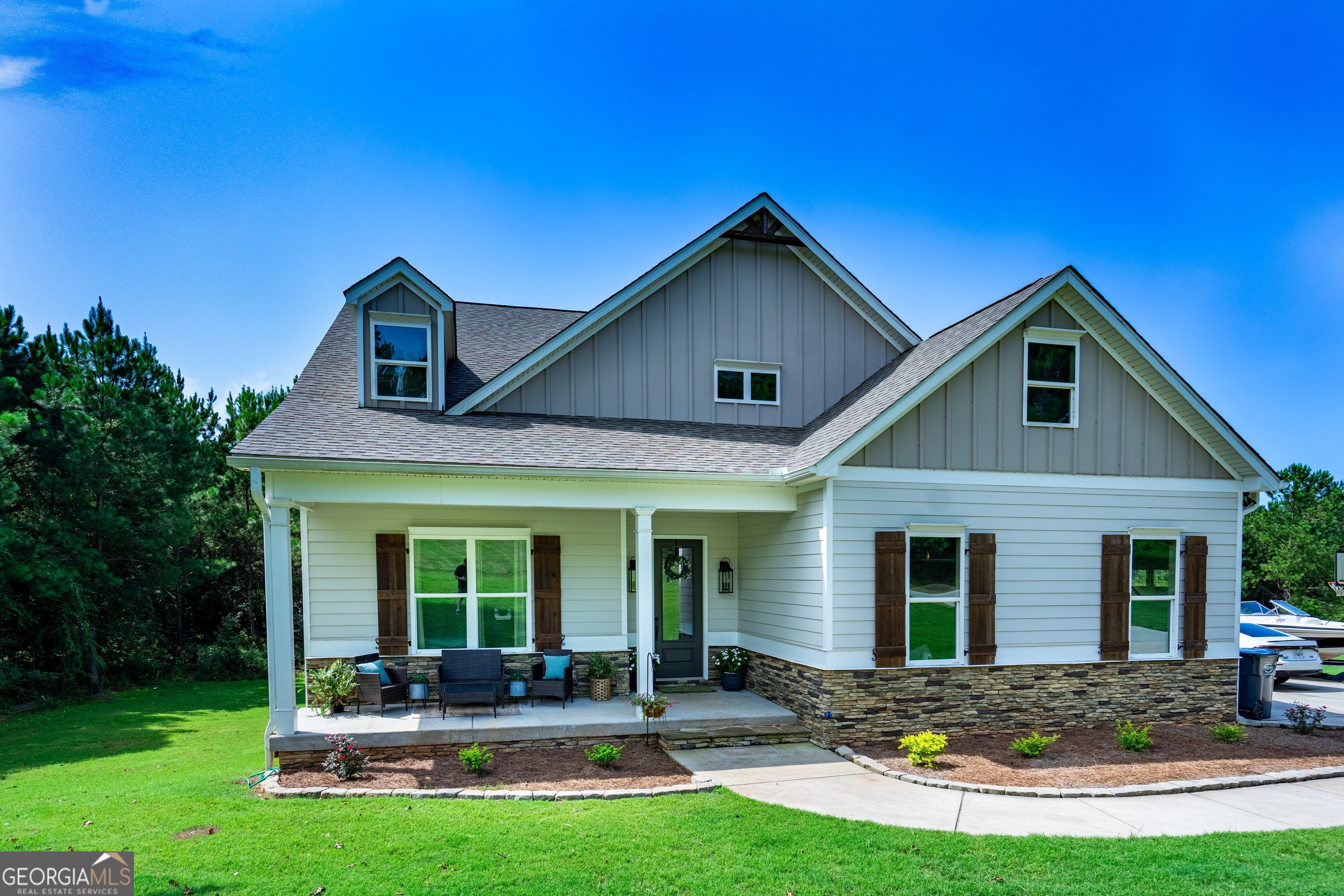 a front view of a house with a yard