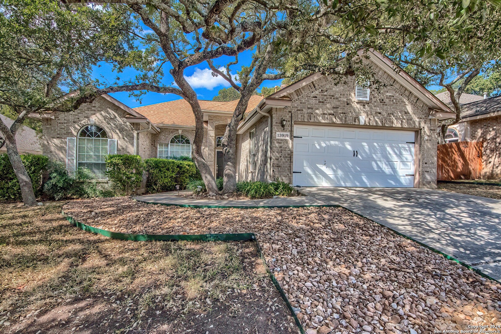 a house with a trees in front of it