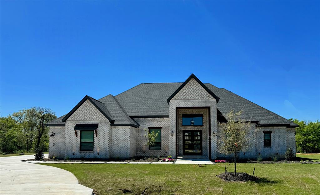 front view of a house with a yard