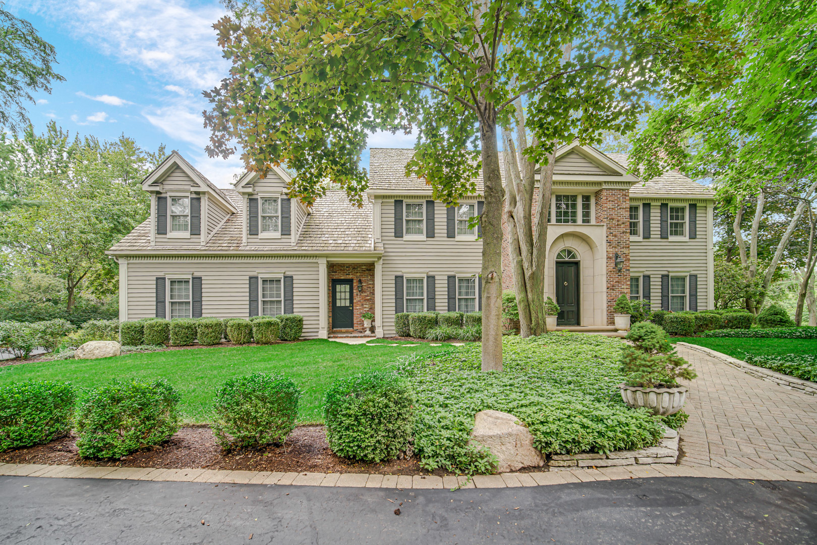 a front view of a house with a yard