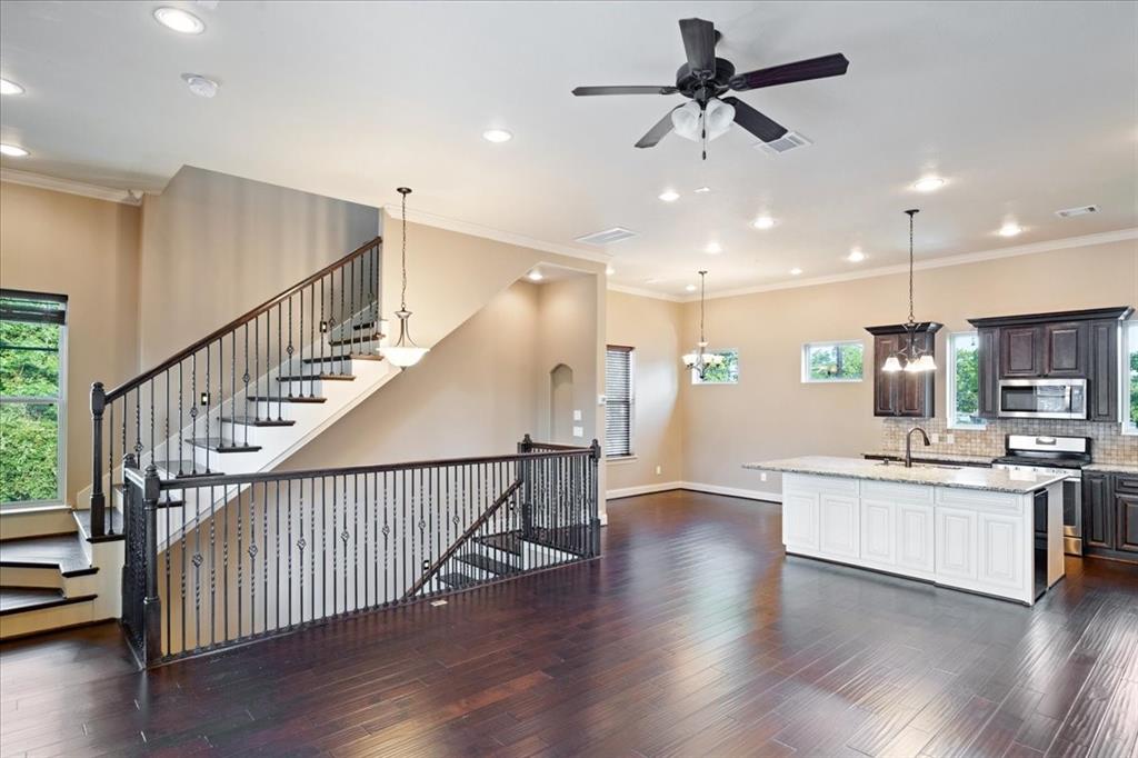 a view of kitchen with sink and wooden floor