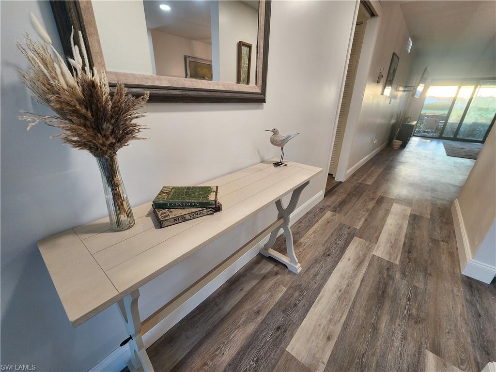 Hallway featuring dark hardwood / wood-style floors