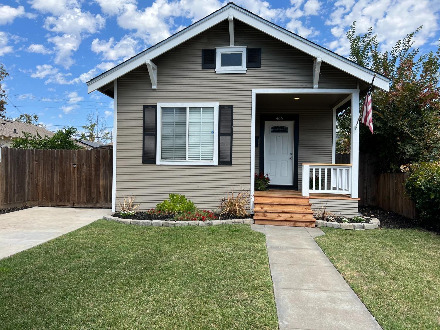 a front view of a house with garden