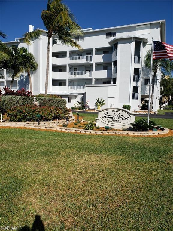 a front view of a building with garden