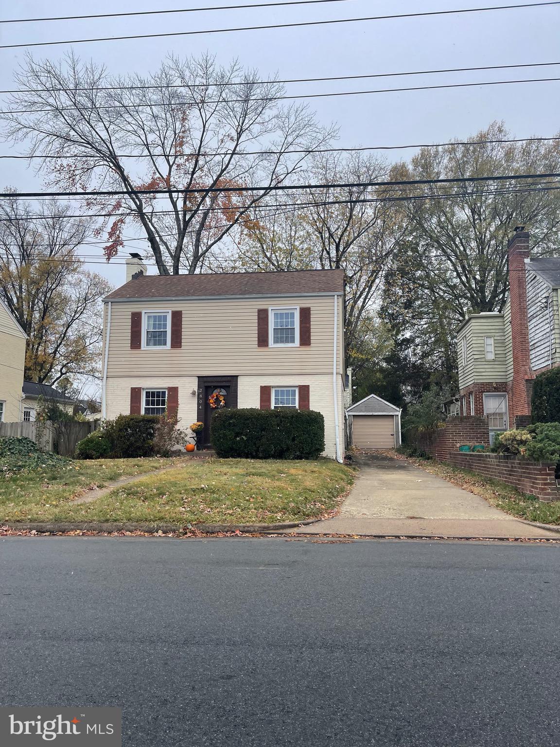 a house that has a tree in front of it