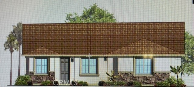 a front view of a building with potted plants