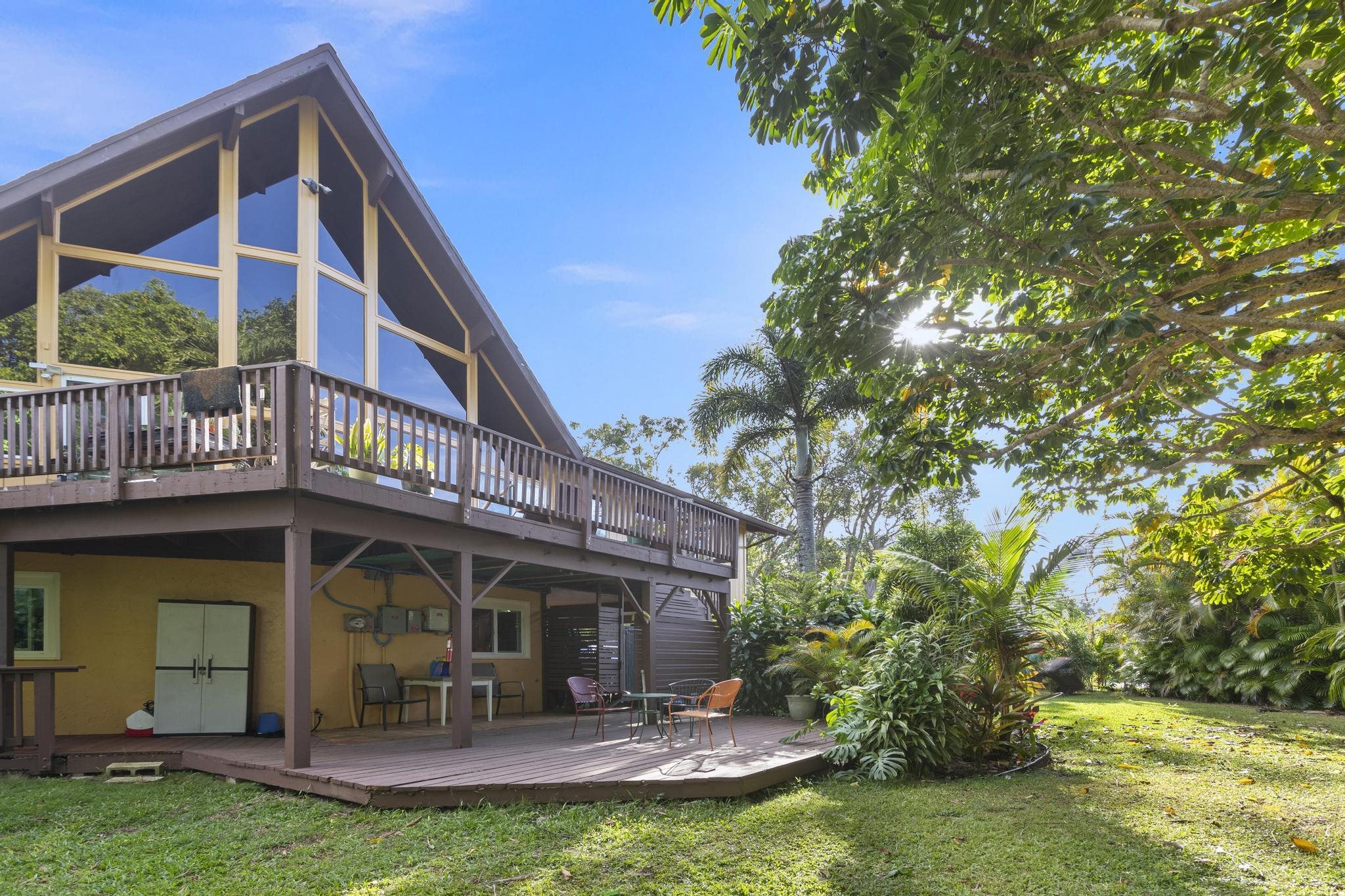 a view of a house with a yard porch and sitting area