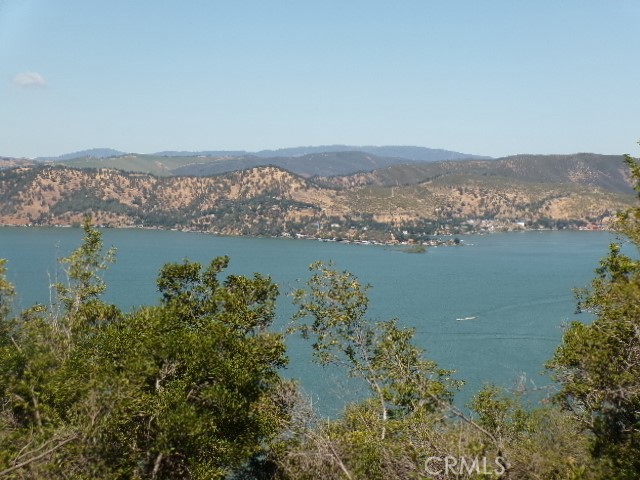 an aerial view of a houses with a lake view