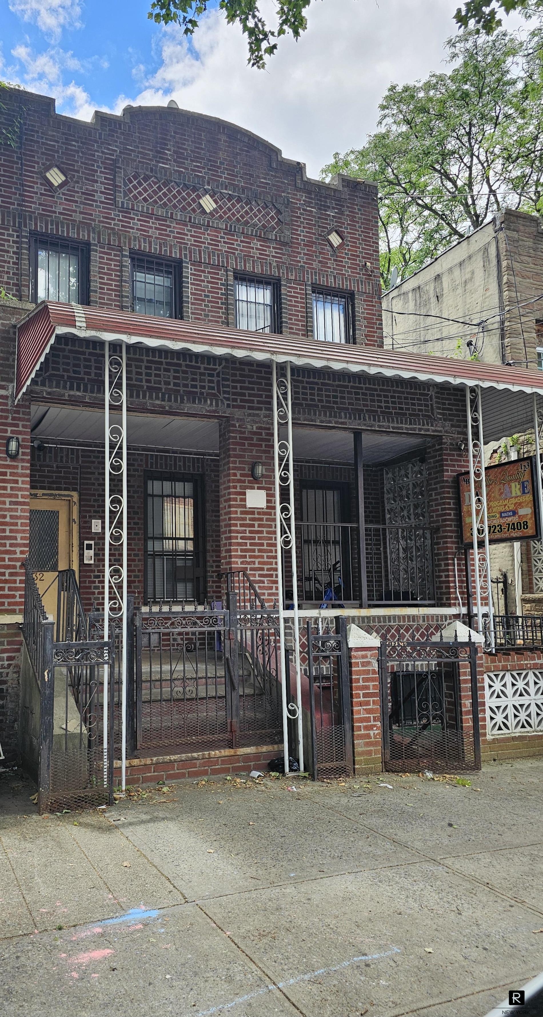 a front view of a house with a garage