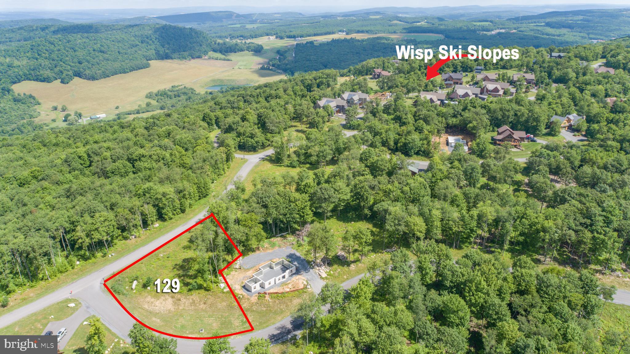 an aerial view of a house with a yard basket ball court and outdoor seating