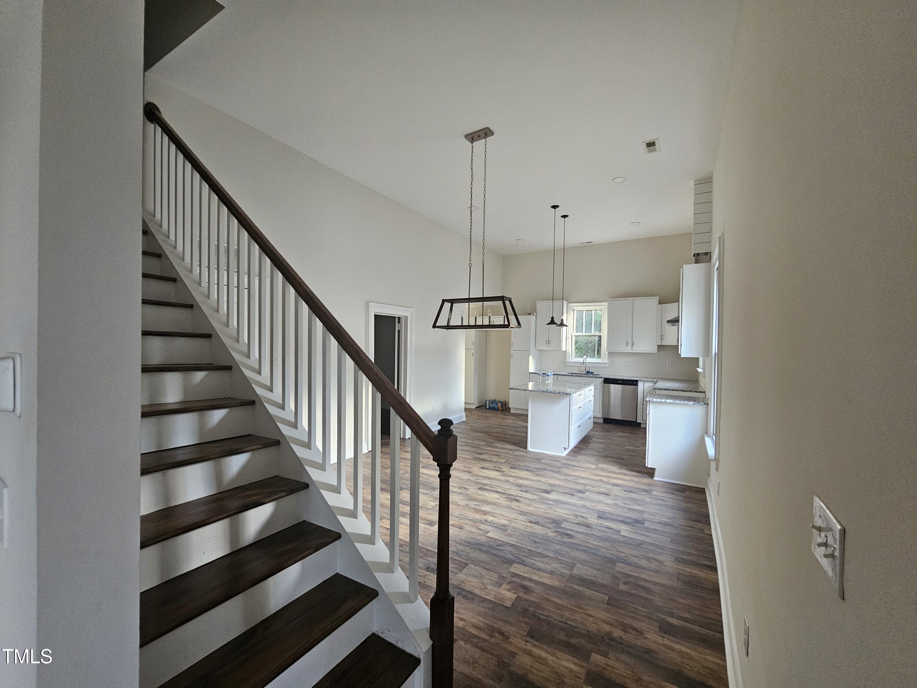 a view of a living room and entryway