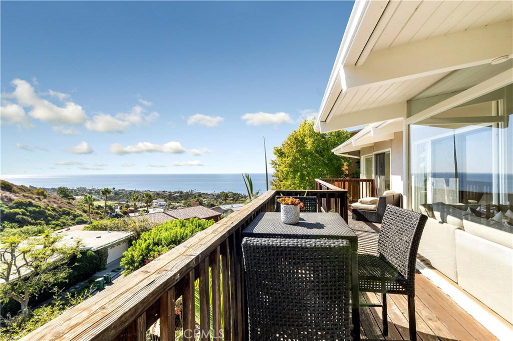 a balcony with furniture and city view