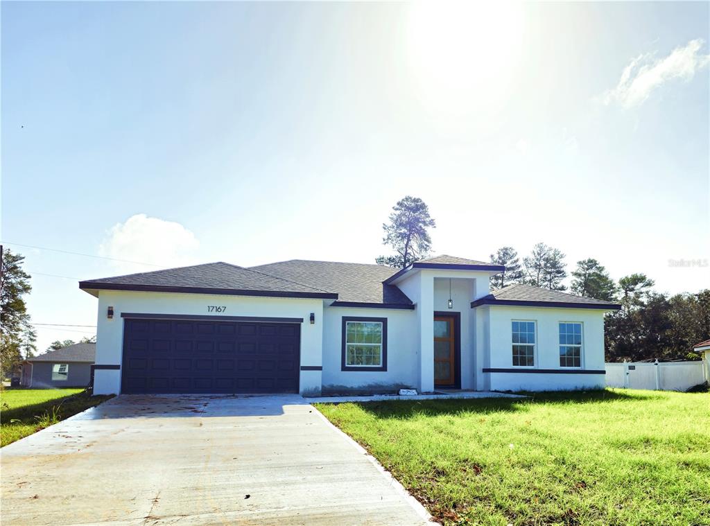 a front view of a house with yard