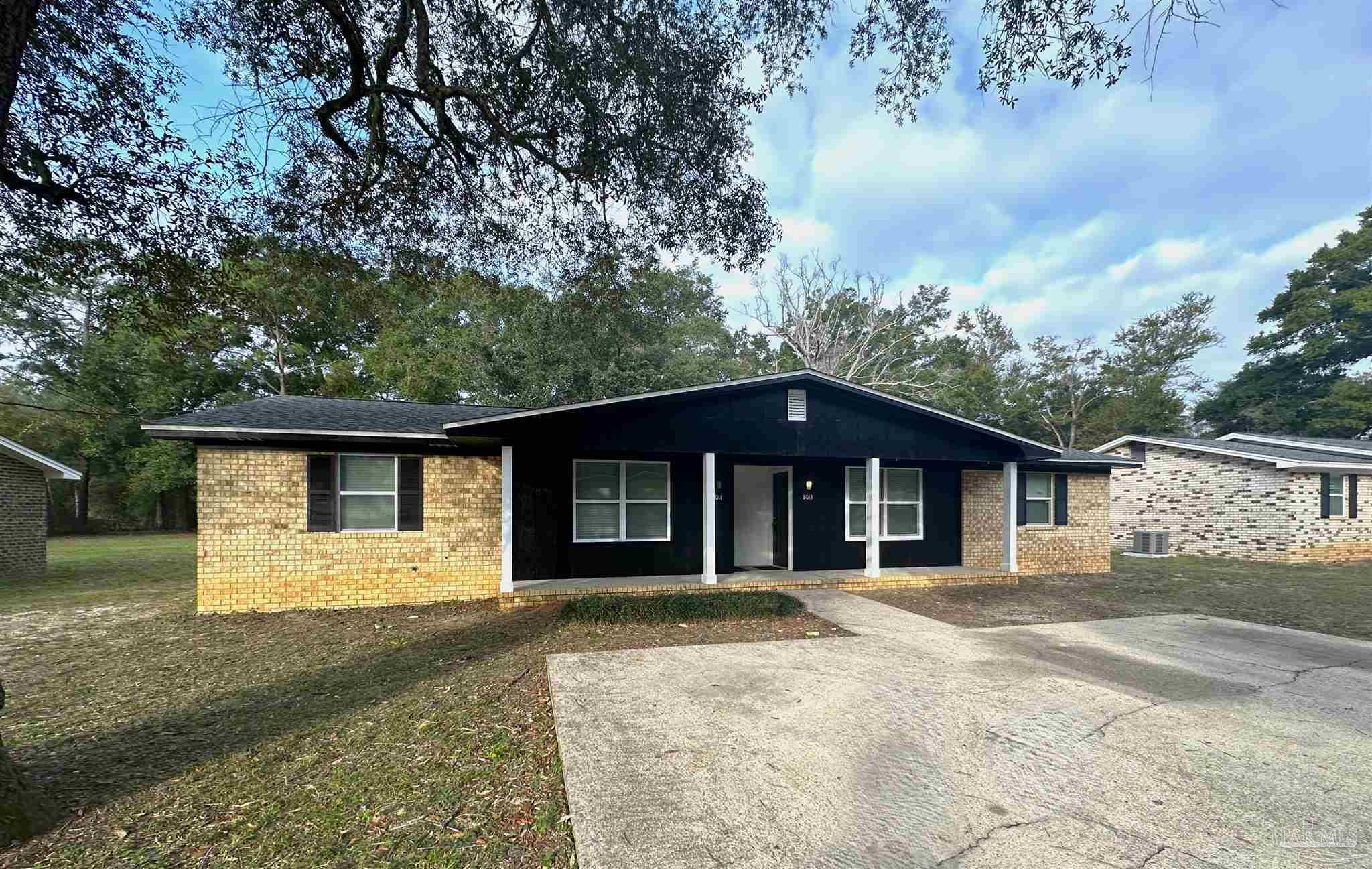 front view of a house with a yard