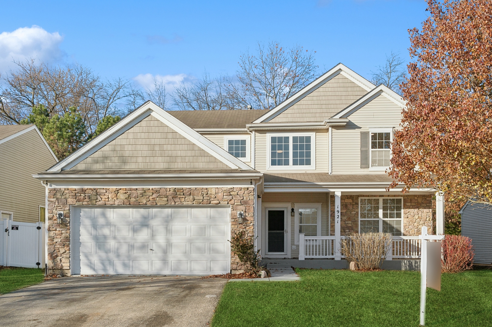 front view of a house with a yard