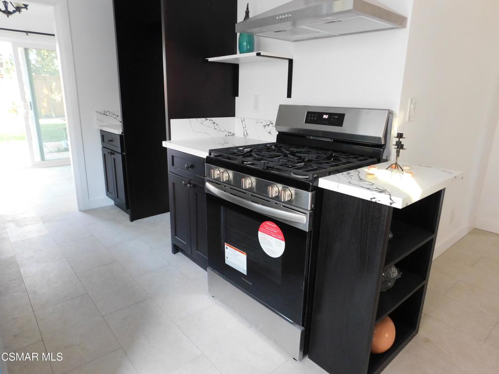 a kitchen with a stove and a microwave