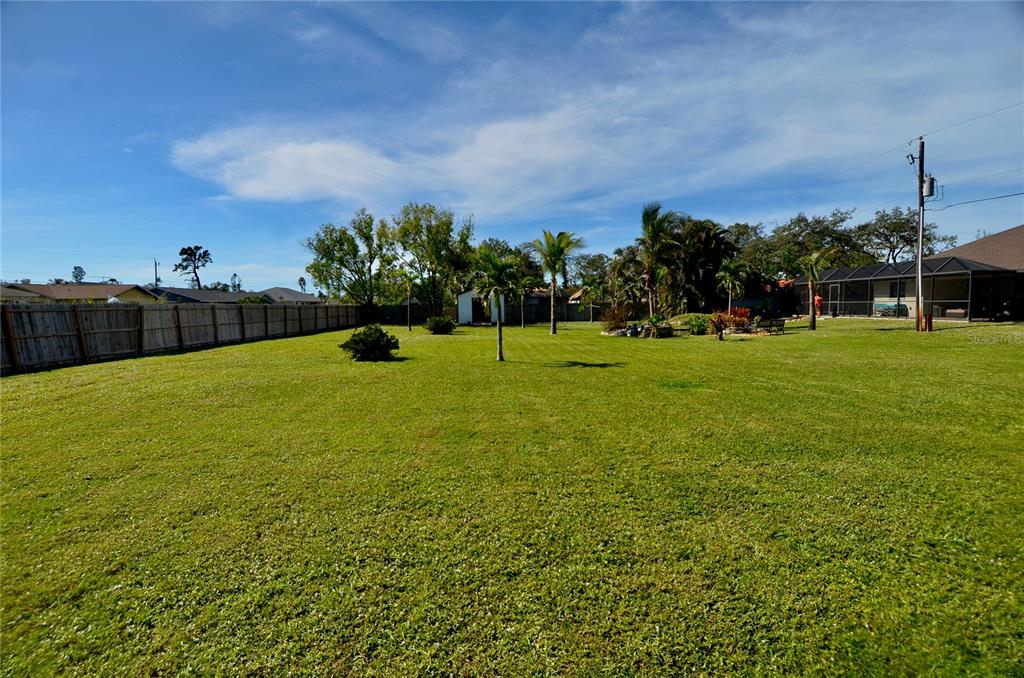 a view of a field with a big yard