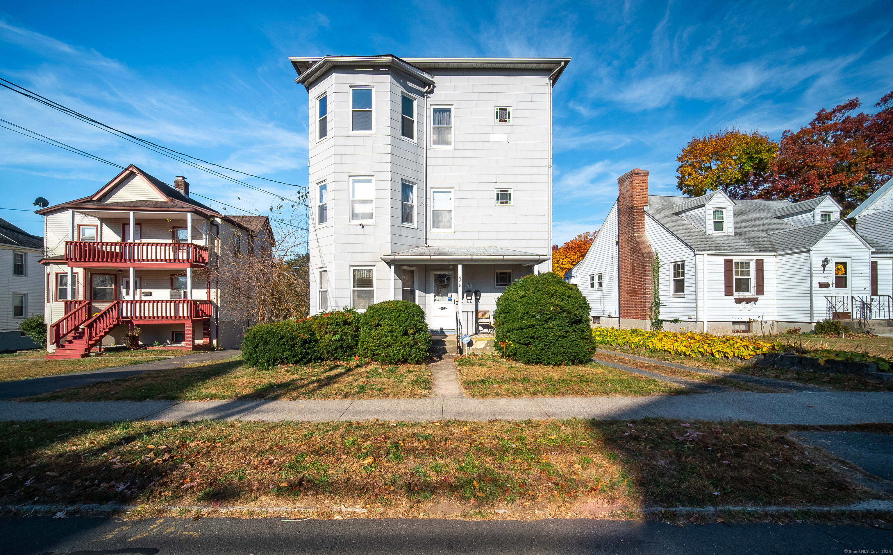 a front view of a house with a yard