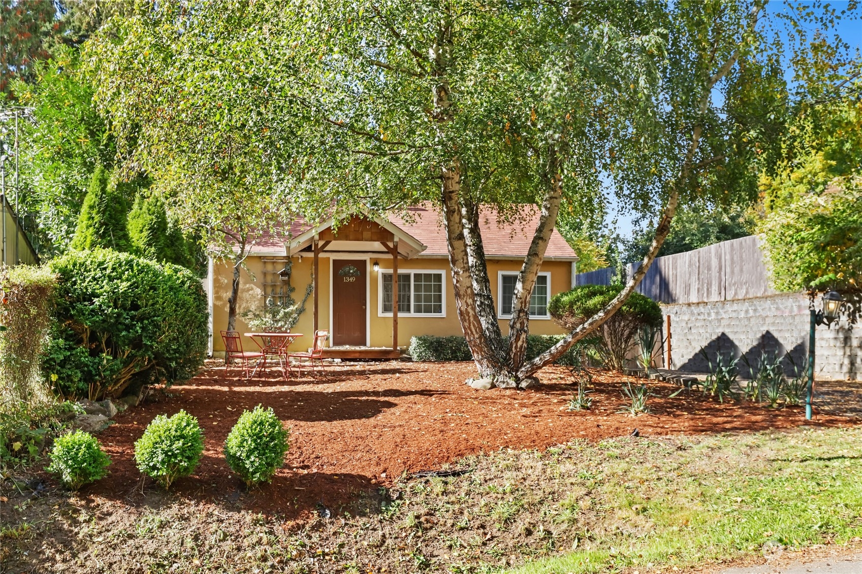 a front view of a house with garden