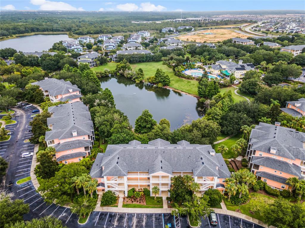 an aerial view of a city with lake view