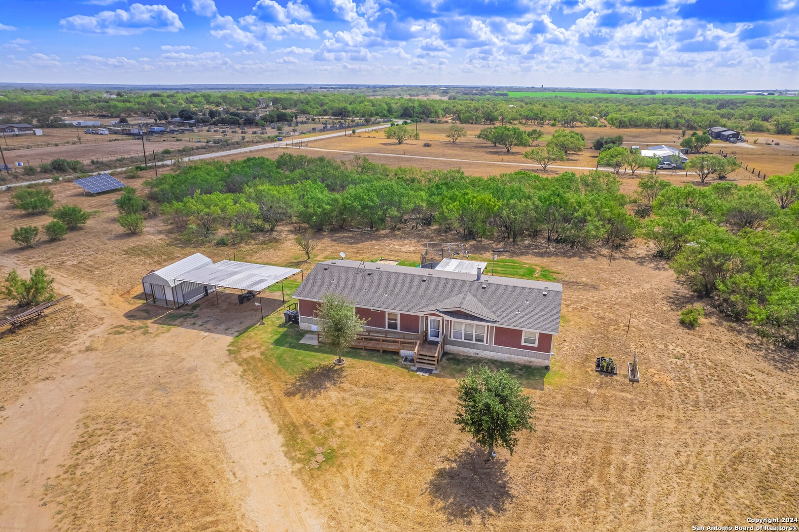 an aerial view of residential houses with outdoor space