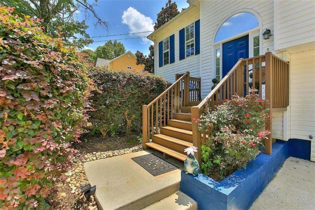 a view of stairs and flowers