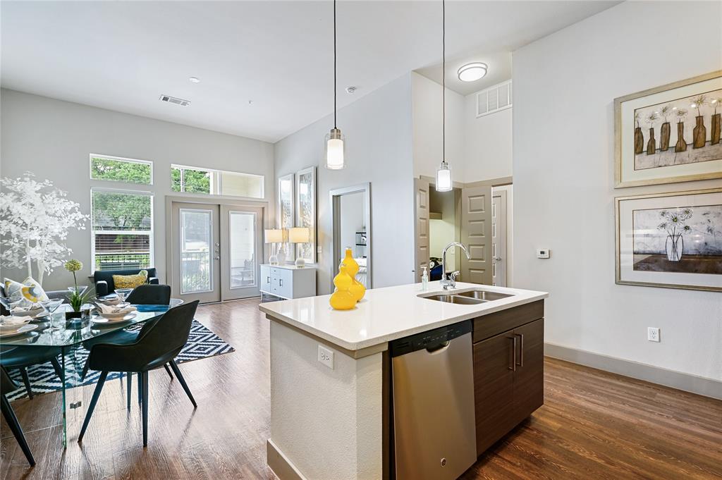 a room with a table chairs and wooden floor