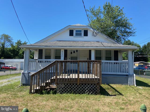 a front view of a house with a deck